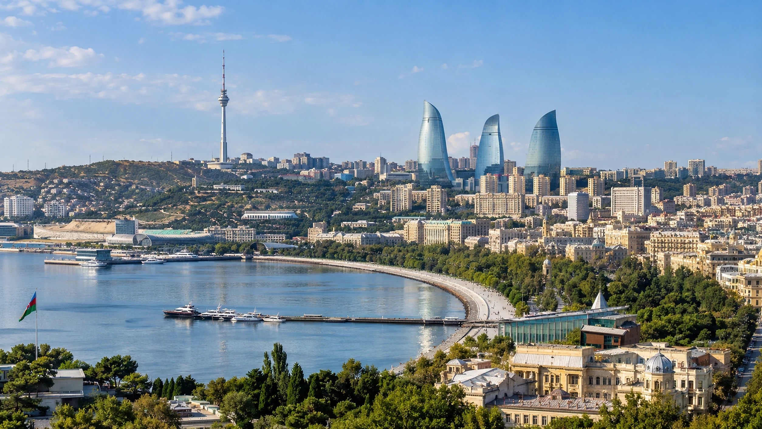 Baku bay and city skyline, Baku, Azerbaijan | Karobar Gateways Baku bay in daylight with the TV tower and the Flame Towers above the city and the seafront